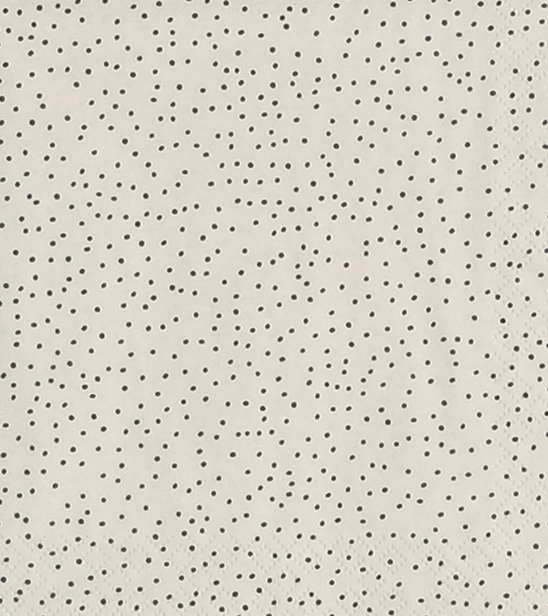 Ljusbeige bakgrund med ett oregelbundet mönster av små, mörka prickar.