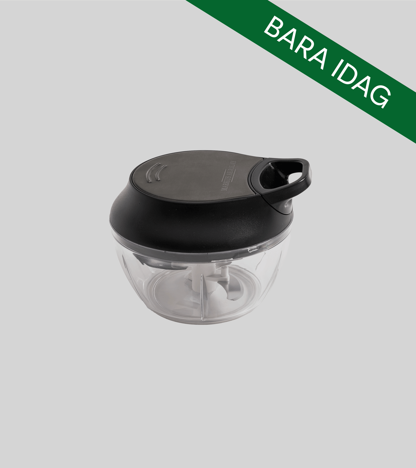 Manuell mathackare med svart lock och klar skål, med 'BARA IDAG' banner. Märket 'MARKUS AUJALAY' på locket.